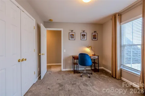 a workspace with furniture and a window