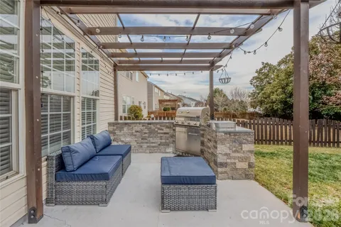 a outdoor living space with patio and glass windows