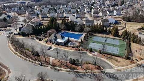 a view of multiple houses with yard