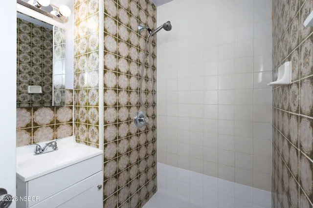 a kitchen with cabinets appliances a sink and a window