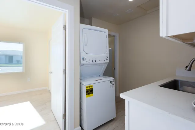 a kitchen with appliances cabinets and a sink