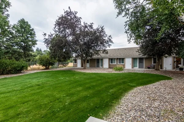 a view of a house with a yard