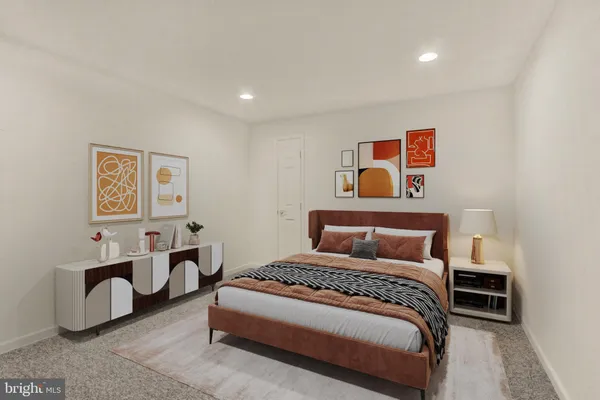 a bedroom with a bed and lamp