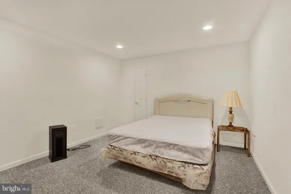 a bedroom with a bed and a table