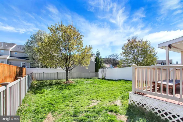 a garden with wooden fence