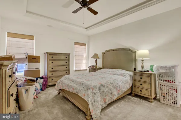a bedroom with a bed and dresser