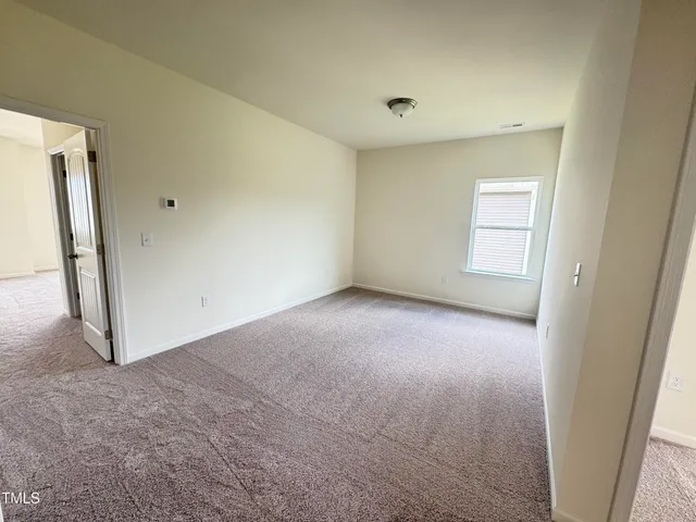 a work room with furniture and a window