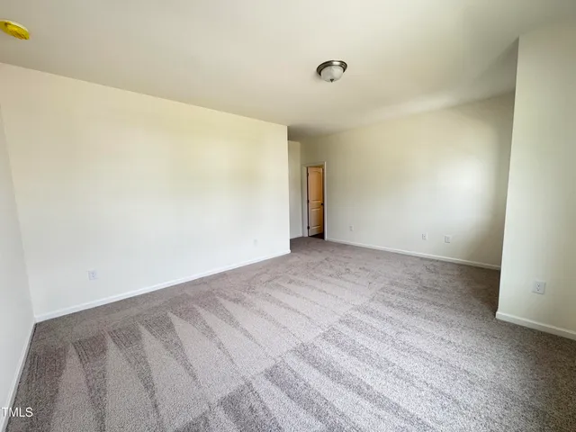 a bedroom with a bed and walk in closet