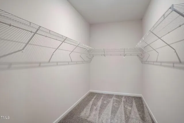 a view of a chairs and table in patio with a yard