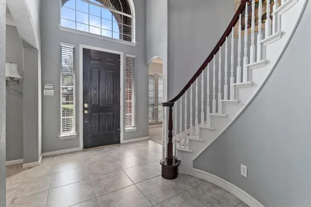 a view of entryway and hall with a door