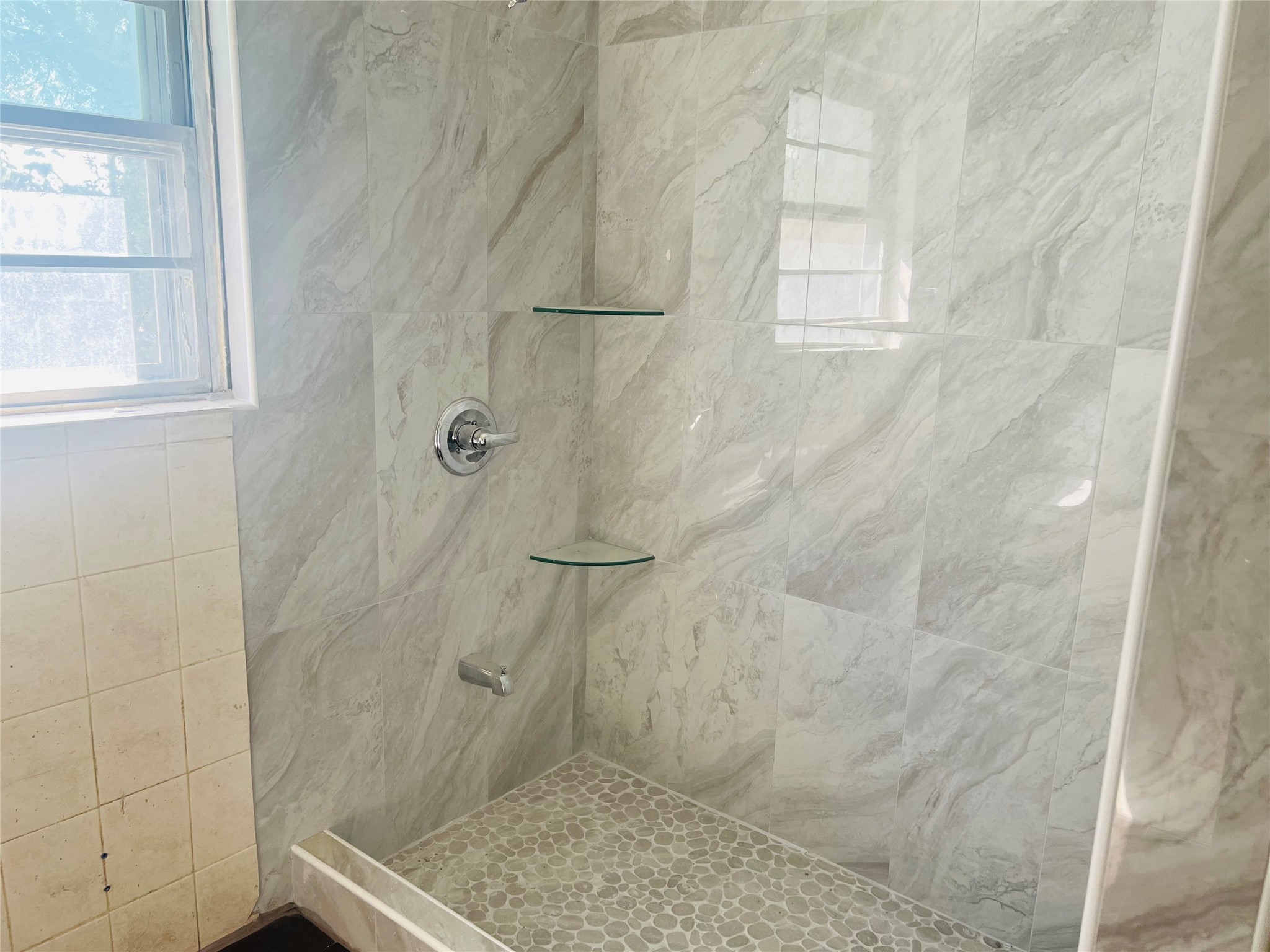 7328 Bauman Road Houston, TX 77022 - Photo 12 of 12 a bathroom with a window