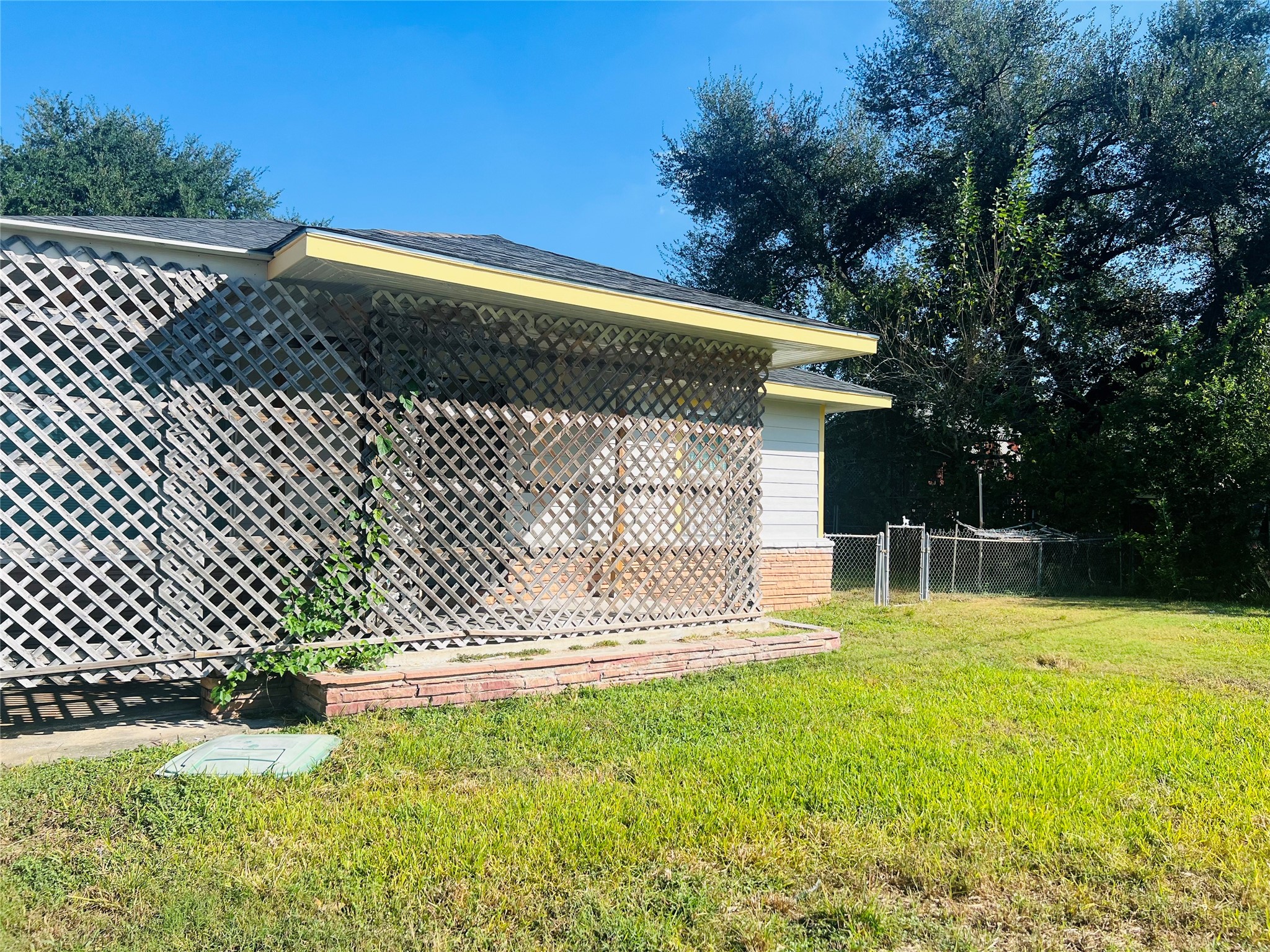 7328 Bauman Road Houston, TX 77022 - Photo 2 of 12 a front view of a house having yard