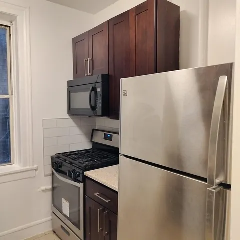 a white refrigerator freezer sitting in a kitchen