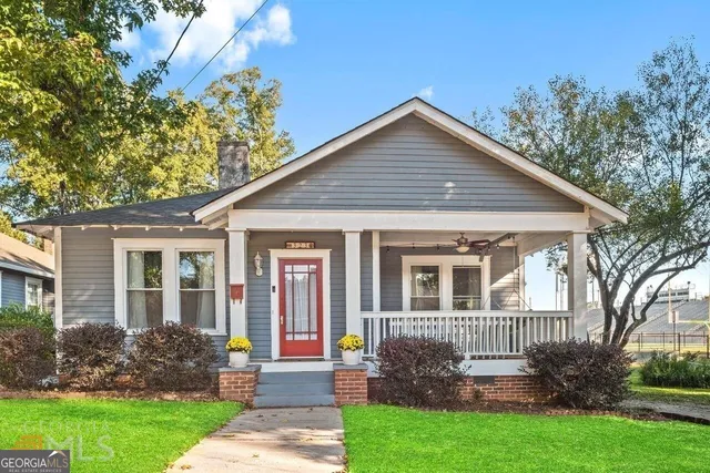 a front view of a house with garden