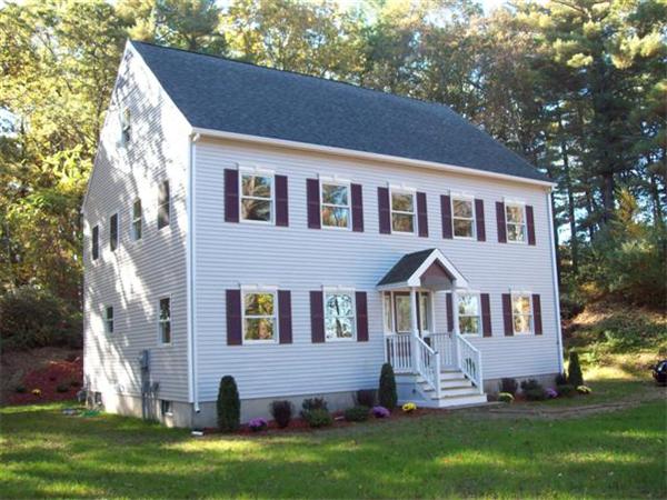 24 South Martin Road Amesbury, MA 01913 - Photo 1 of 8 a front view of house with yard and green space