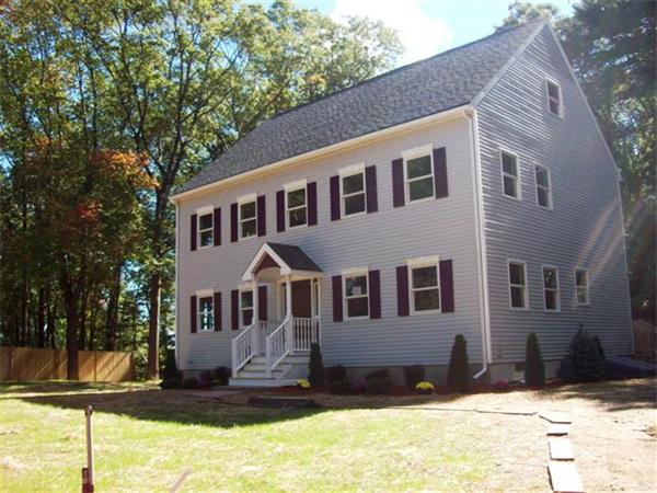 24 South Martin Road Amesbury, MA 01913 - Photo 2 of 8 a front view of a house with a yard
