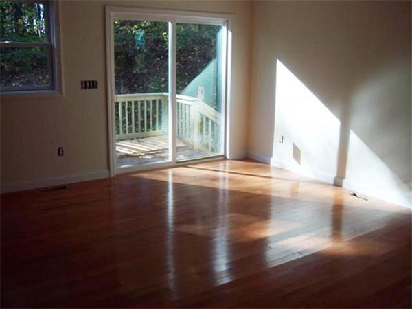 24 South Martin Road Amesbury, MA 01913 - Photo 6 of 8 a view of a floor to ceiling window and wooden floor