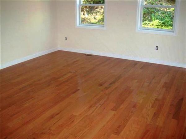 24 South Martin Road Amesbury, MA 01913 - Photo 8 of 8 an empty room with wooden floor and windows