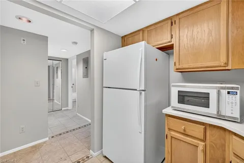 a view of cabinets with wooden cabinets