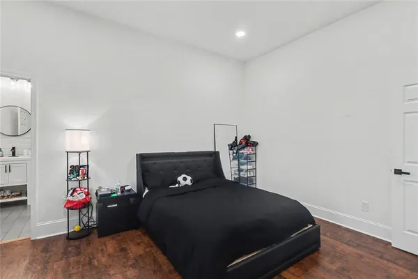 a bedroom with a bed and a book shelf