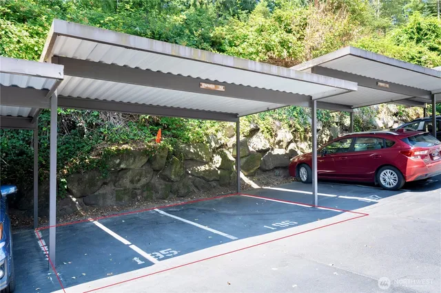 a view of a car park in front of a house