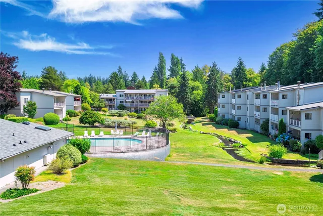 a view of a swimming pool with a garden