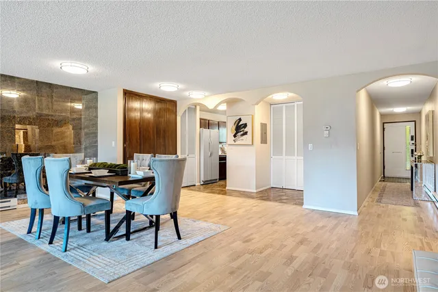 a view of a dining room with furniture and wooden floor