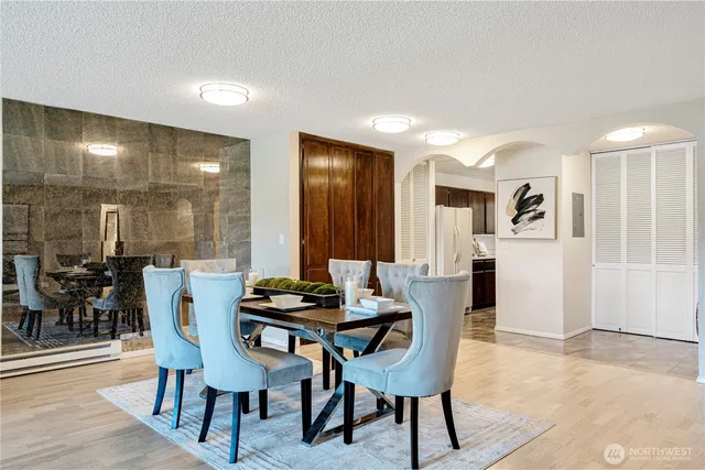a dining room with furniture and window