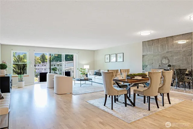 a view of a dining room with furniture and wooden floor