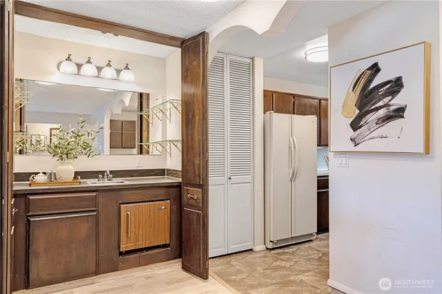 a kitchen with cabinets and stainless steel appliances