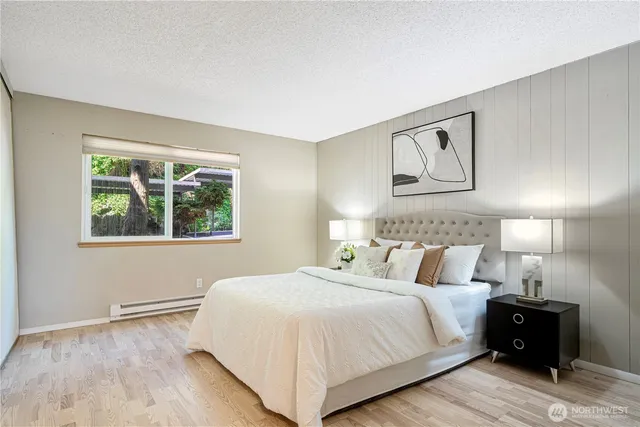 a bedroom with a bed and a window