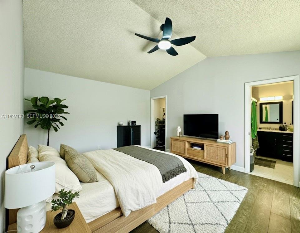 14145 Southwest 100th Terrace Miami, FL 33186 - Photo 11 of 15 a bedroom with a bed and a flat screen tv