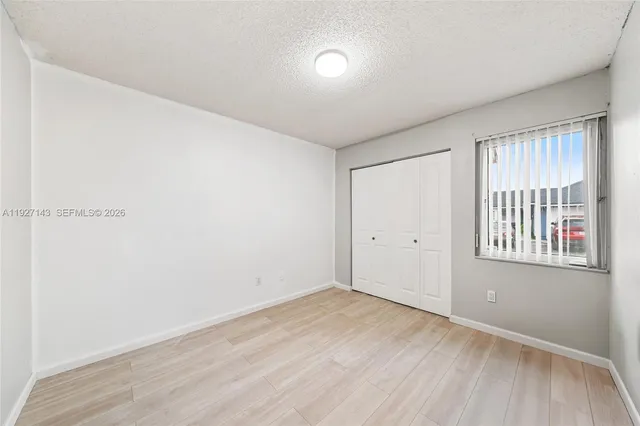 a view of a room with toys and wooden floor
