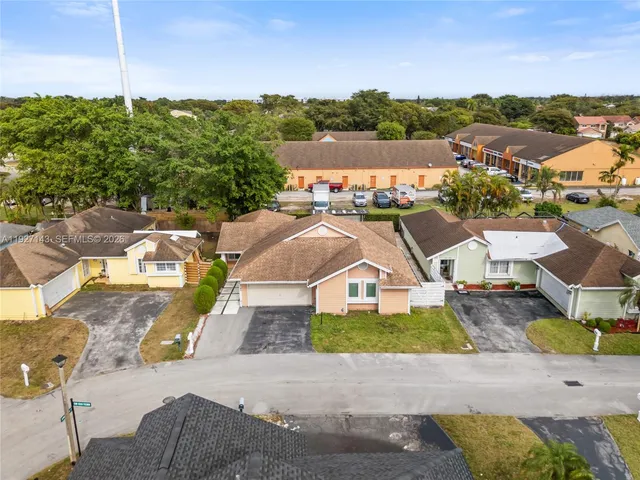 a view of house with a garden