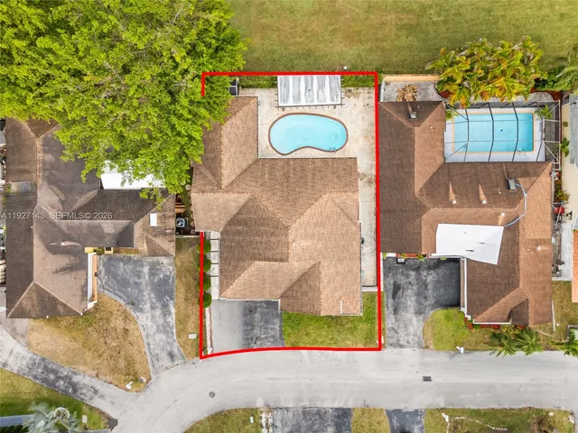 an aerial view of residential houses with outdoor space