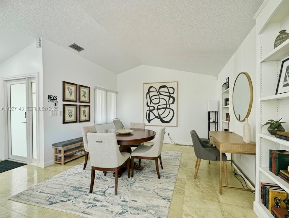 14145 Southwest 100th Terrace Miami, FL 33186 - Photo 4 of 15 a view of a livingroom and dining room