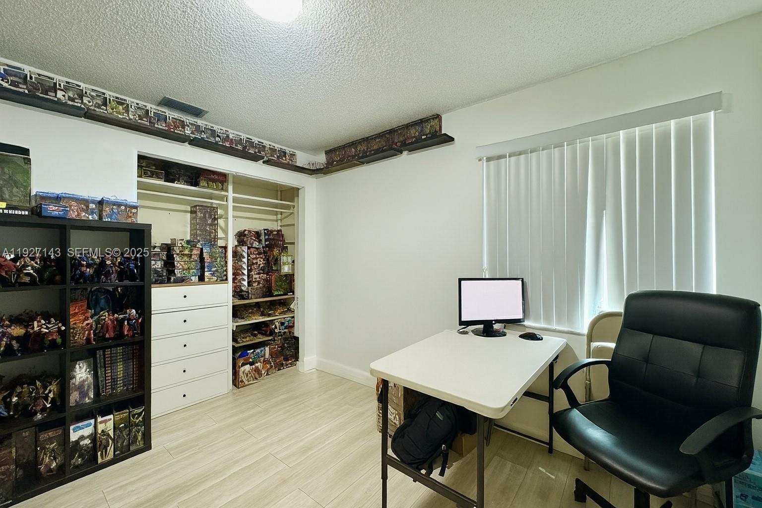 14145 Southwest 100th Terrace Miami, FL 33186 - Photo 7 of 15 a room with furniture and a window