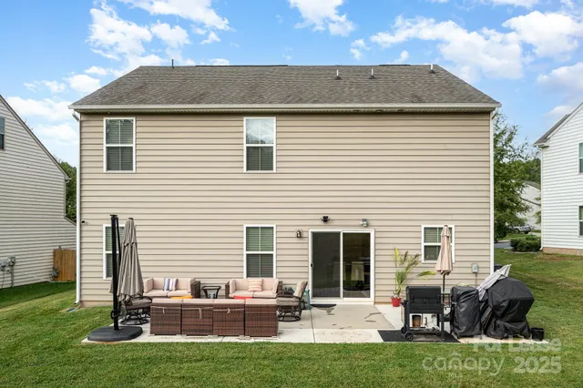 a backyard of a house with seating space