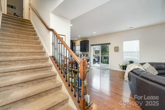 a view of staircase with wooden floor and stairs