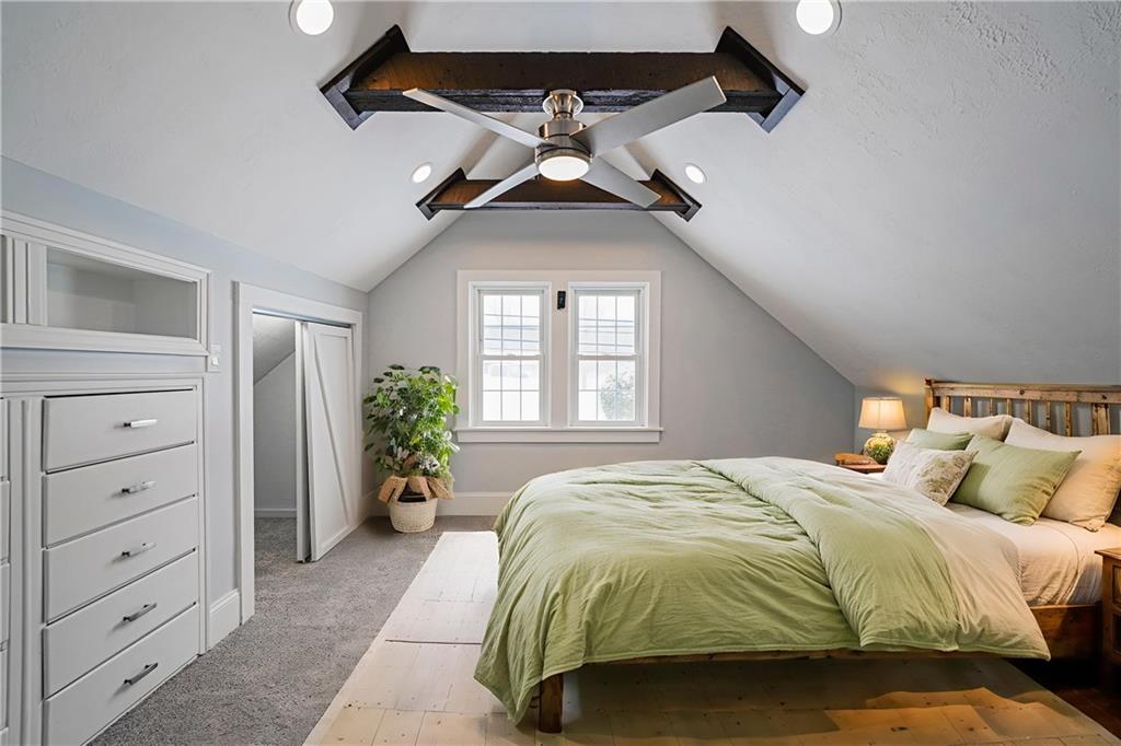 671 Old Rte 8 Harrisville, PA 16038 - Photo 43 of 49 a spacious bedroom with a bed and a chandelier