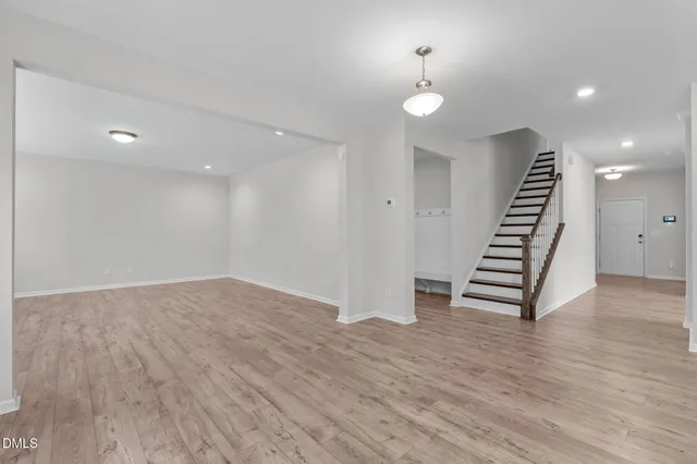 a large kitchen with a large window and a sink