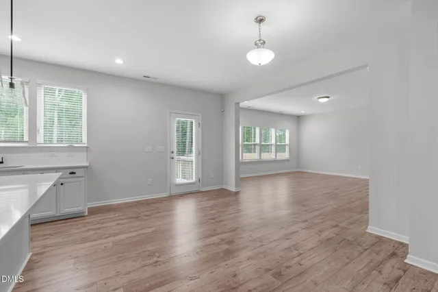 a view of an entryway with wooden floor