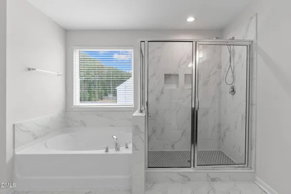 a bathroom with a granite countertop sink vanity and mirror