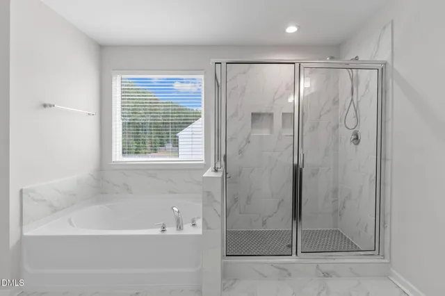 a bathroom with a granite countertop sink vanity and mirror