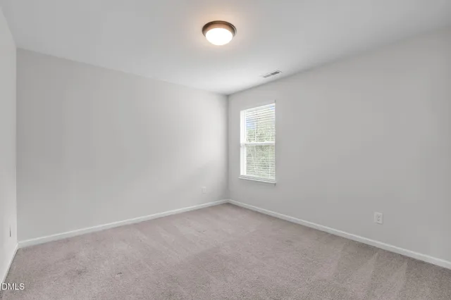a bathroom with a sink double vanity and a mirror