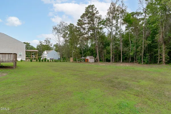 a backyard of a house with lots of green space