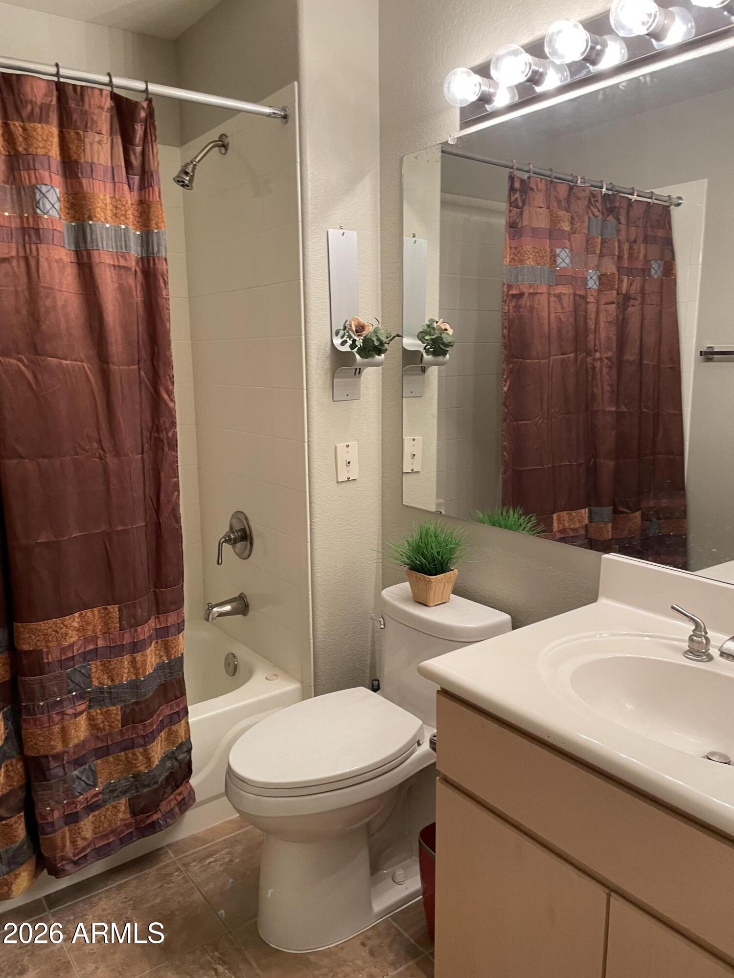5303 North 7th Street, Unit 113 Phoenix, AZ 85014 - Photo 14 of 21 a bathroom with a sink a toilet and shower