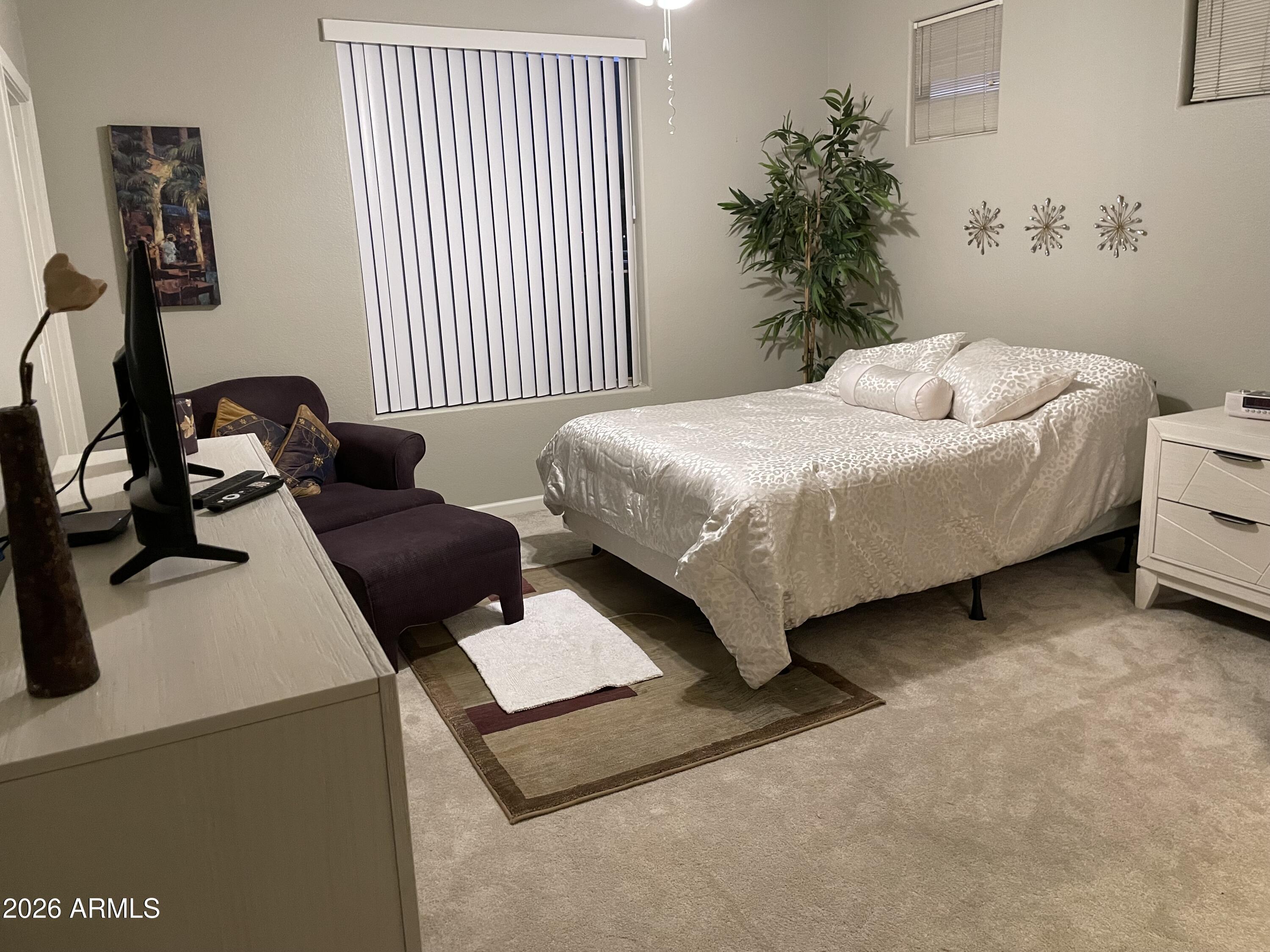 5303 North 7th Street, Unit 113 Phoenix, AZ 85014 - Photo 15 of 21 a bedroom with a bed and a couch