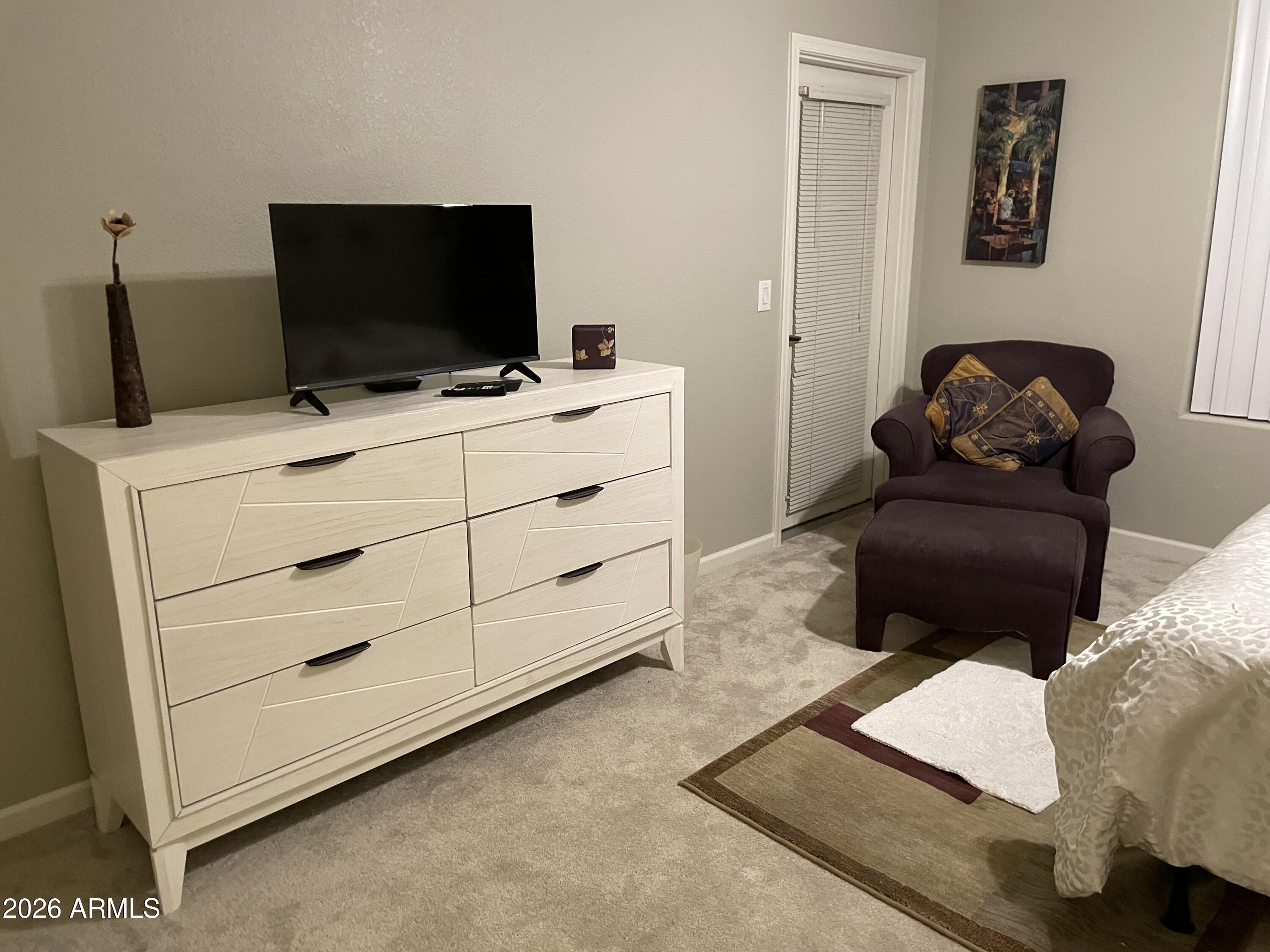 5303 North 7th Street, Unit 113 Phoenix, AZ 85014 - Photo 17 of 21 a room with furniture and a flat screen tv