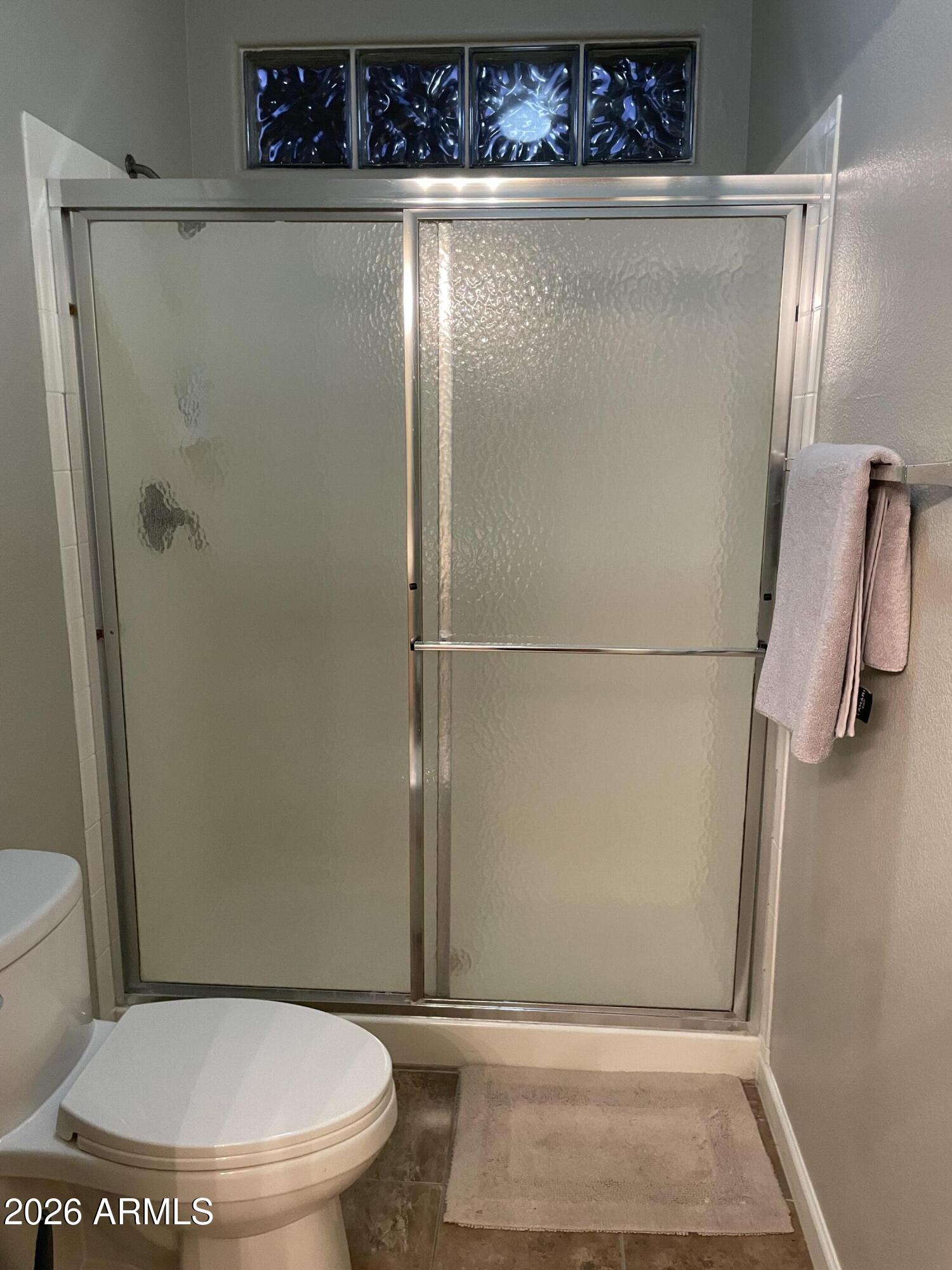 5303 North 7th Street, Unit 113 Phoenix, AZ 85014 - Photo 20 of 21 a bathroom with a toilet and a shower